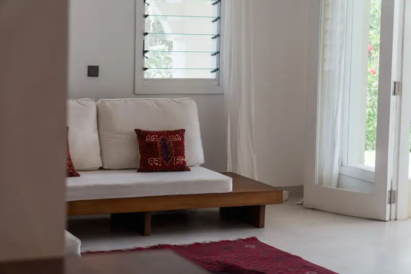 A reading nook with white cushions