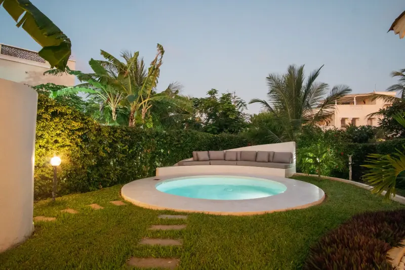 The round pool in the garden at sunset