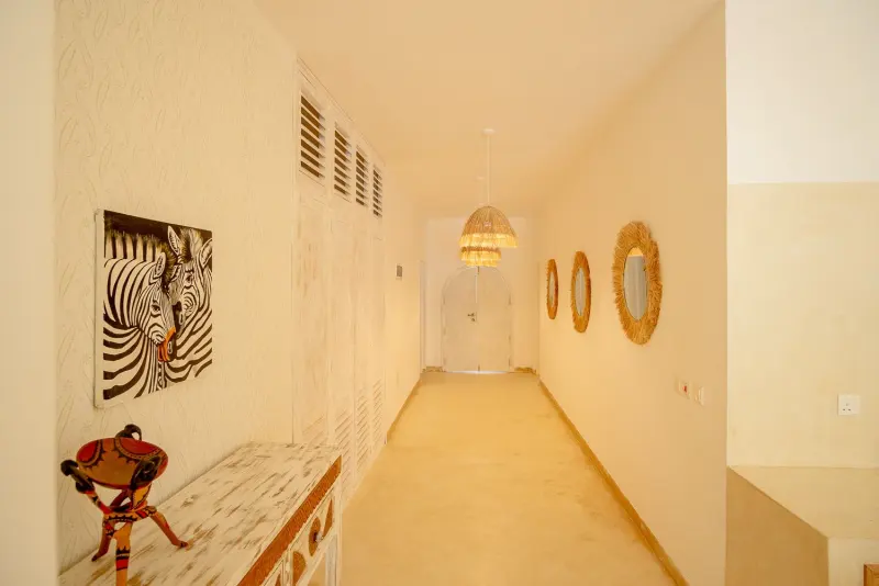 The long hallway decorated with African art