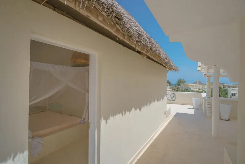 The roof terrace under a thatched edge