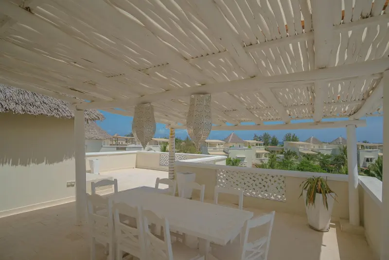 Dining under the pergola with sea views